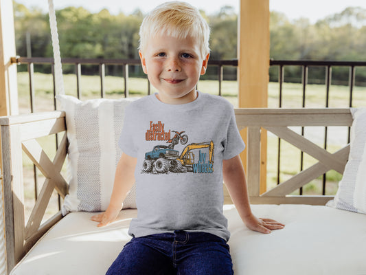 Toddler boy wearing an Easily Distracted By Wheels toddler tee