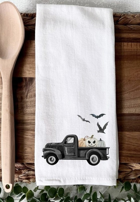 Truck with jack-o-lanterns and bats Halloween kitchen towel