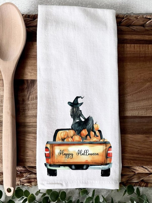 Happy Halloween witch sitting on truck with pumpkins kitchen towel