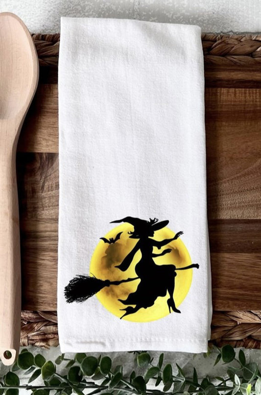 Witch flying on broom in front of moon kitchen towel